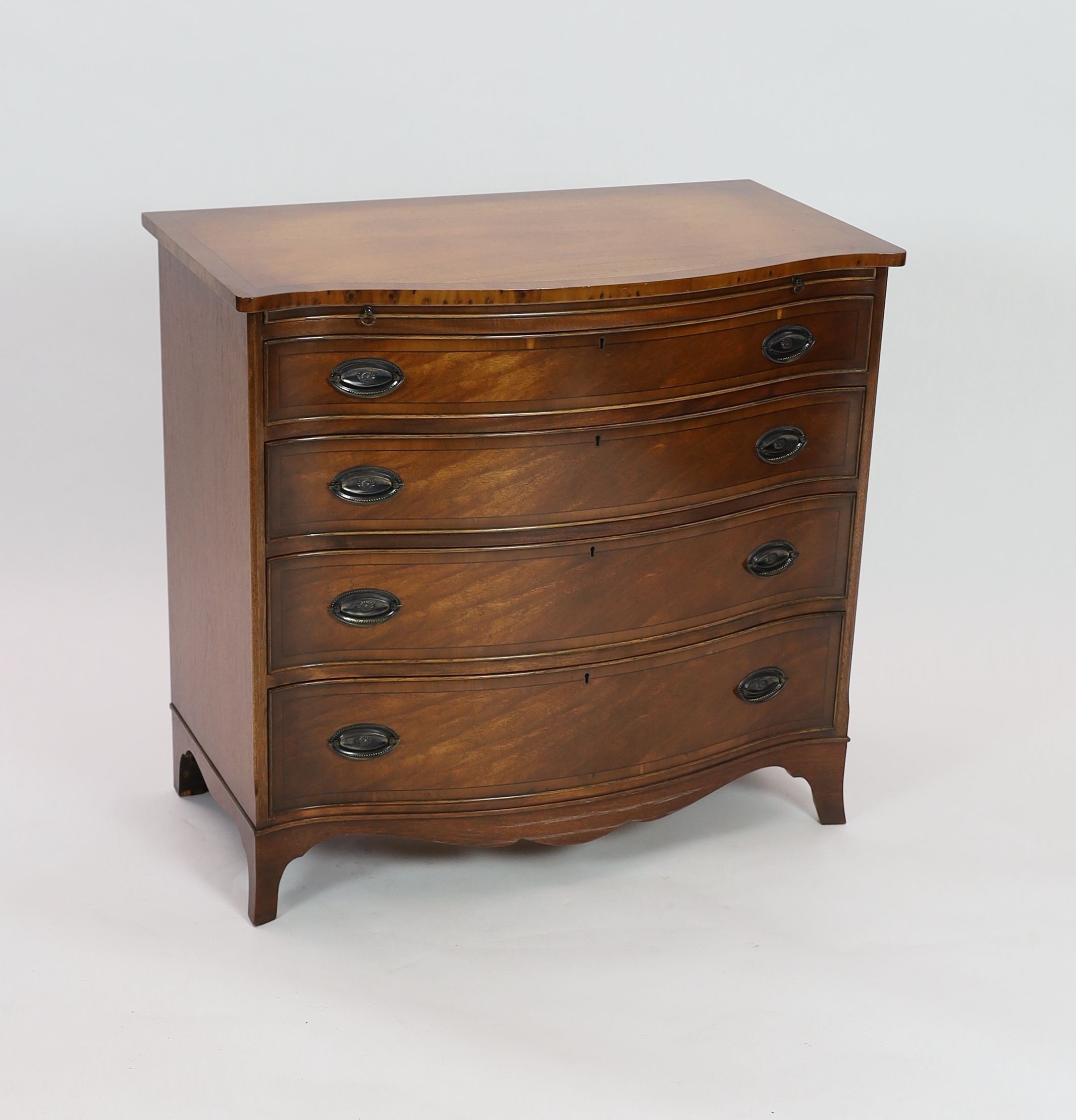 A reproduction George III design mahogany serpentine chest, with brushing slide, width 92cm depth 51cm height 85cm
